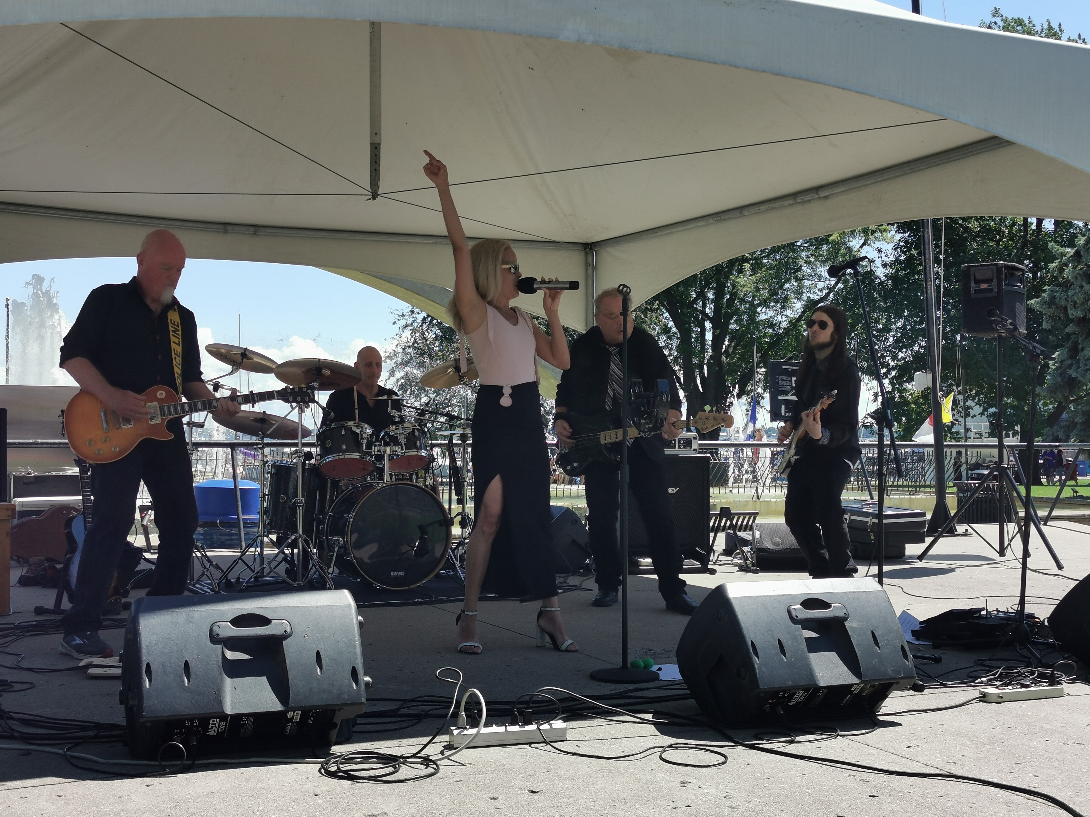 River Cats Live at Confederation Basin - Downtown Kingston 2024 River Cats performing live at Confederation Basin downtown Kingston with city skyline backdrop and afternoon crowd