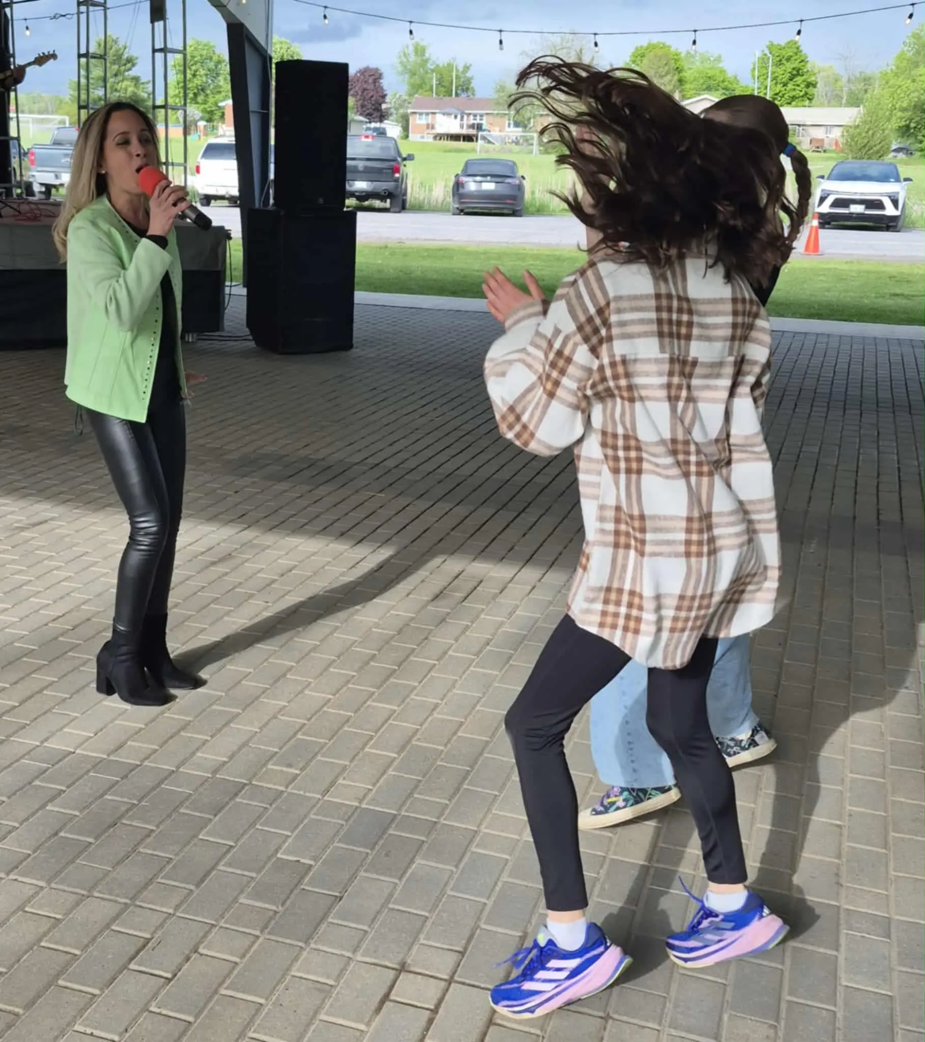 Kiri from River Cats band dancing on stage during live performance 2024