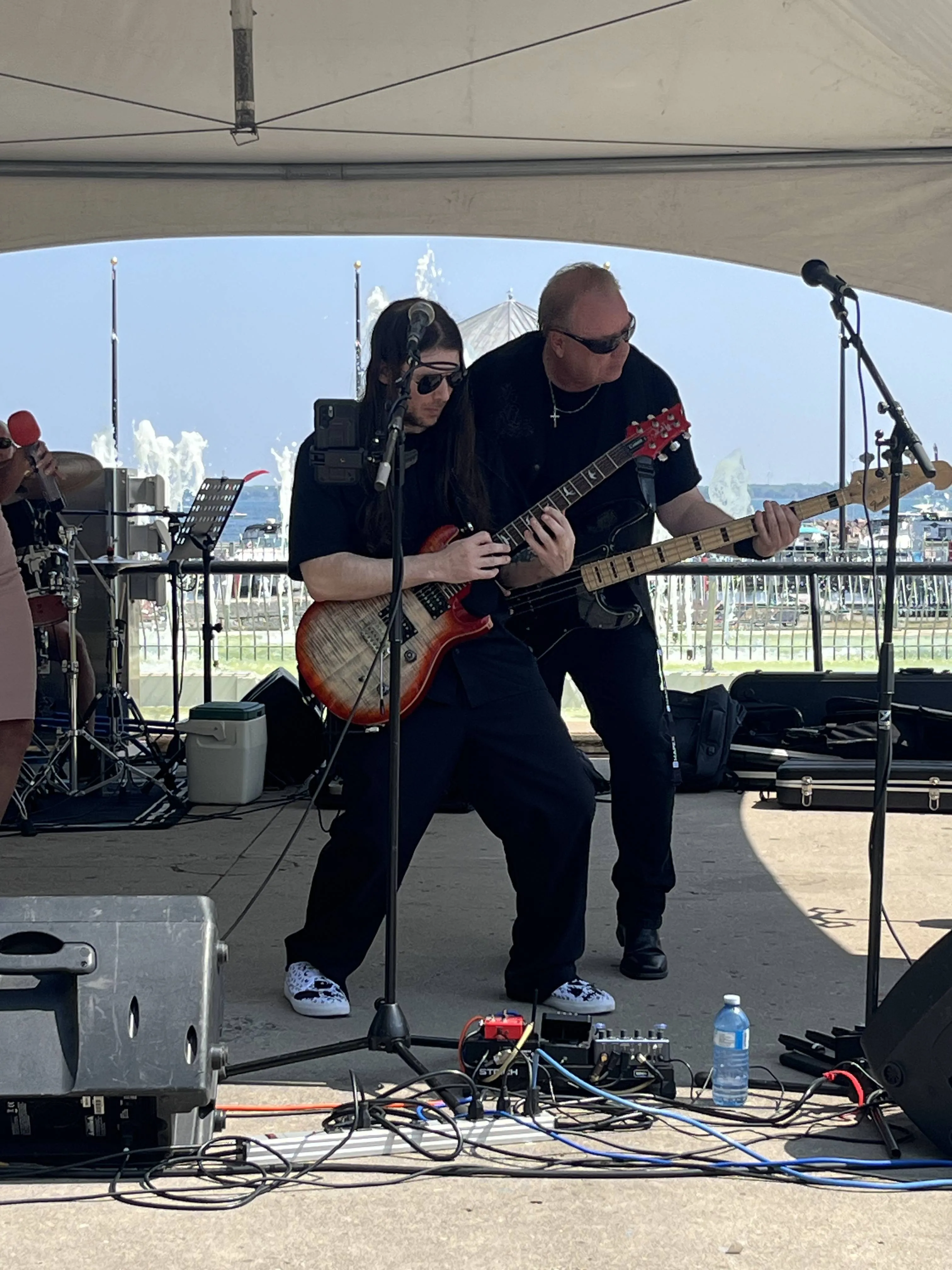 River Cats band members Recon and G performing live on stage in Downtown Kingston