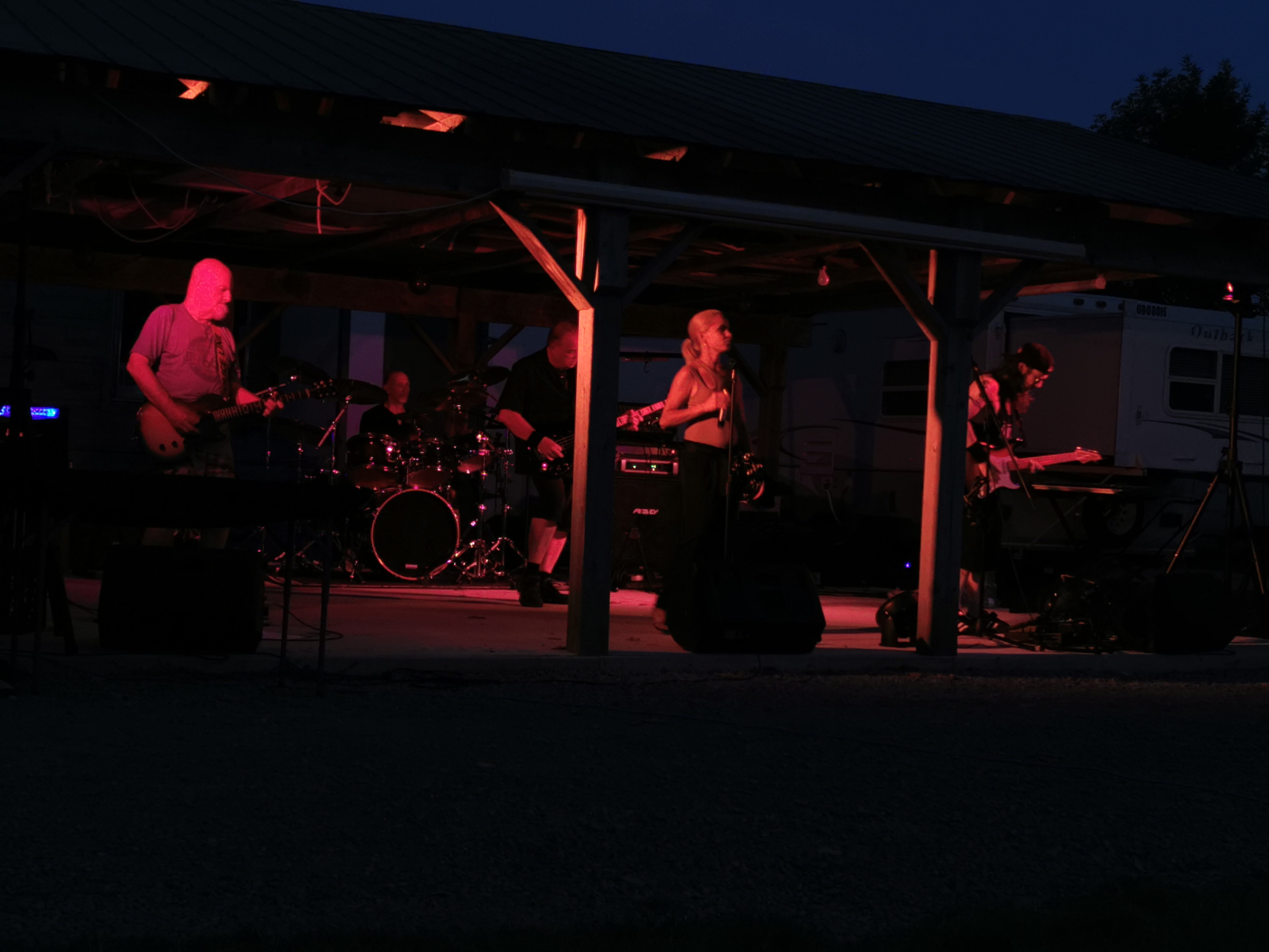 River Cats Waterfront Concert - Ray's Cottages 2024 River Cats outdoor waterfront performance at Ray's Cottages with scenic lake view and evening atmosphere