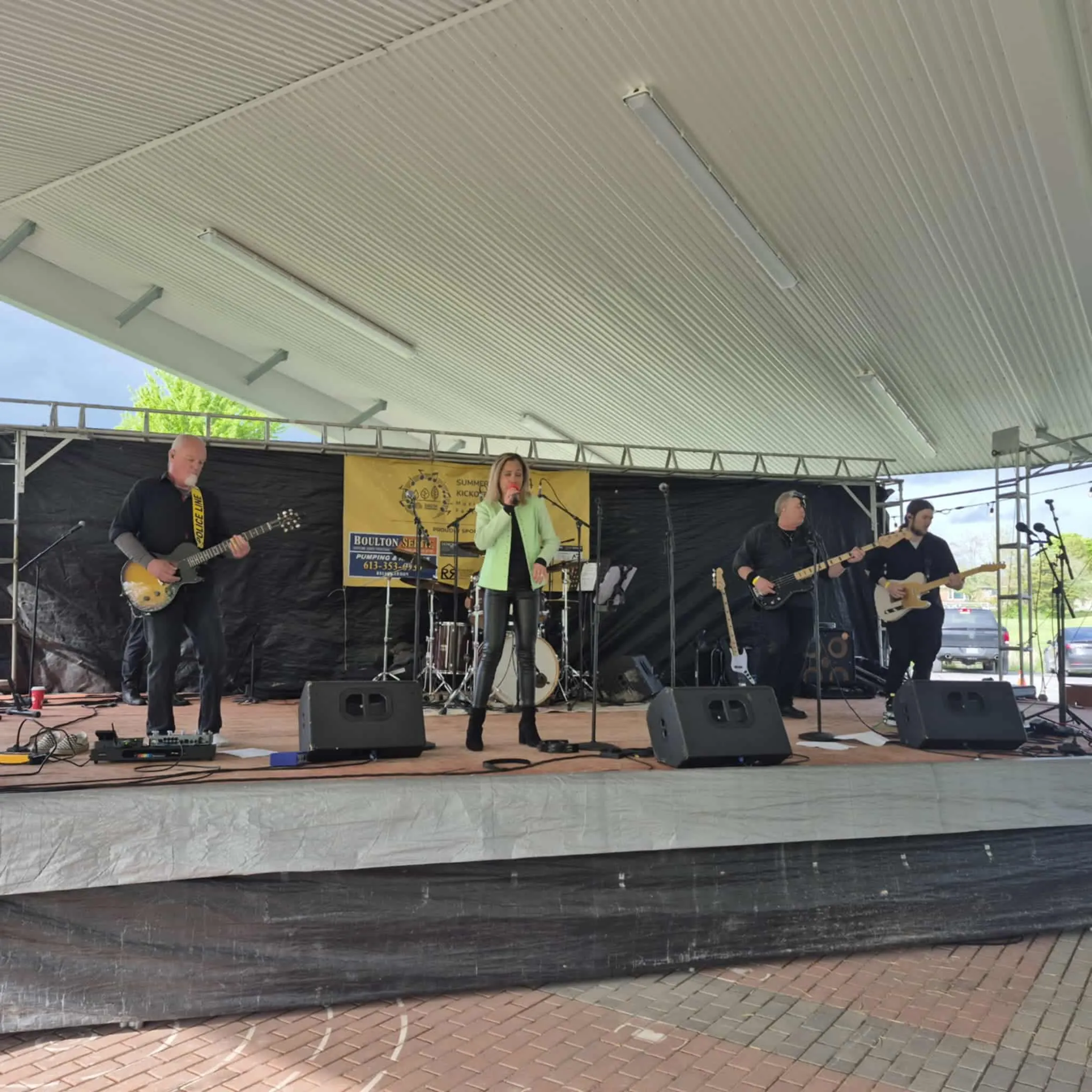 River Cats Summer Kickoff Music Festival at Centennial Park Harrowsmith with outdoor stage and community crowd