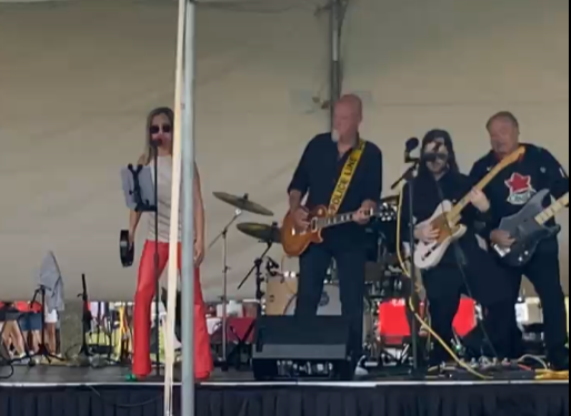 River Cats Canada Day celebration concert in Bath Ontario with Canadian flags and patriotic crowd