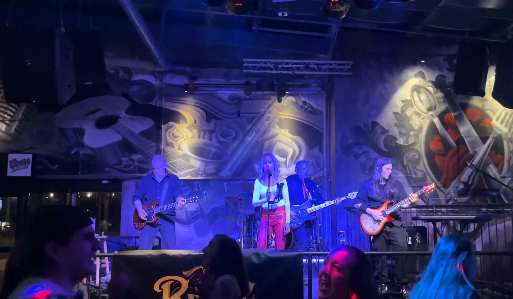 River Cats band performance at Raxx Bar & Grill Kingston with enthusiastic audience and restaurant atmosphere